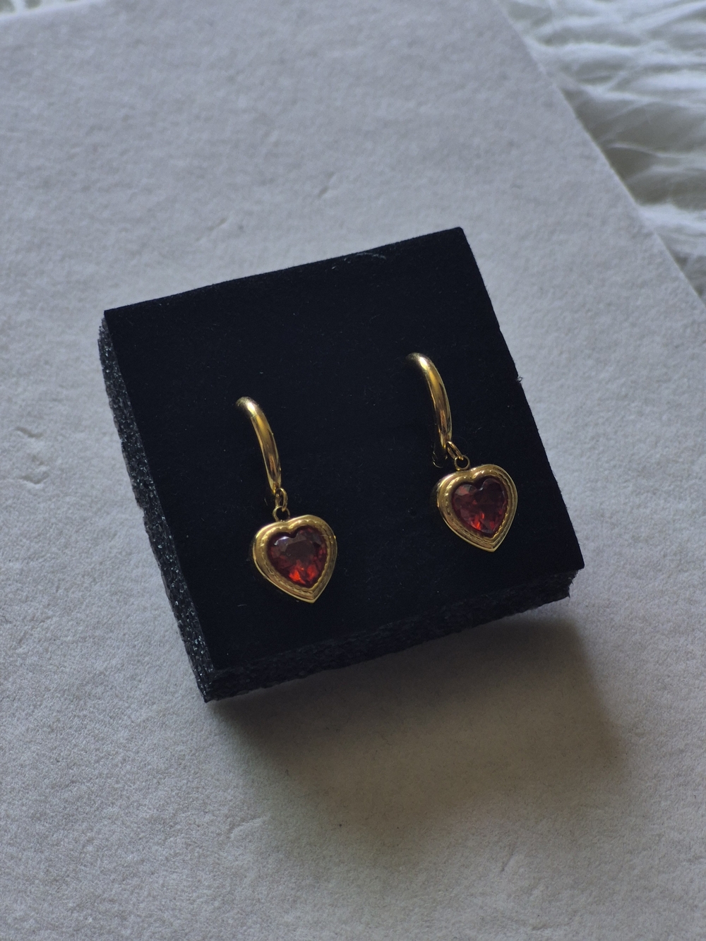 Gold Heart Drop Earrings with Red Gem Accent